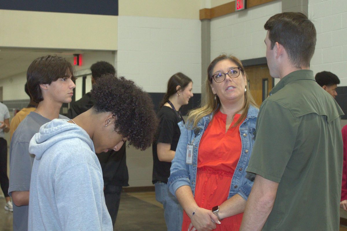 Librarian Amanda Trussell talks with senior David Pemberton about the importance of freedom of speech.