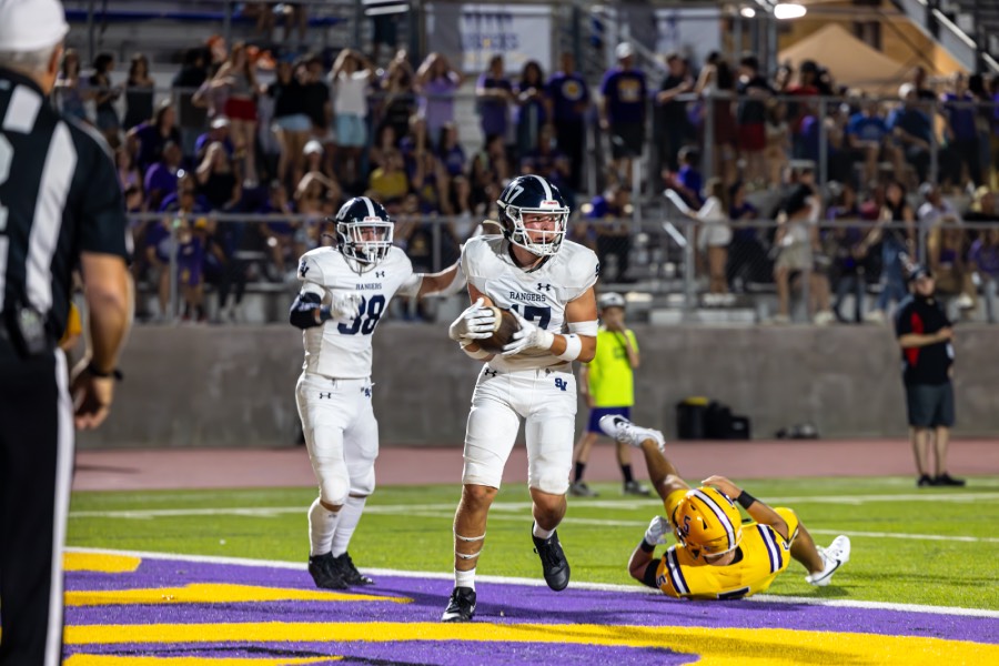 As the Warriors punt the ball to the Rangers, sophomore safety, Hunter Haug(38), blocks the kick, allowing junior line backer, Colton Hornsby(17), to scoop it up for a touchdown. 