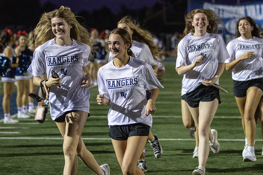 Run-throughs are not just for football any more. The playoff-bound volleyball team gets its chance to run down the field.