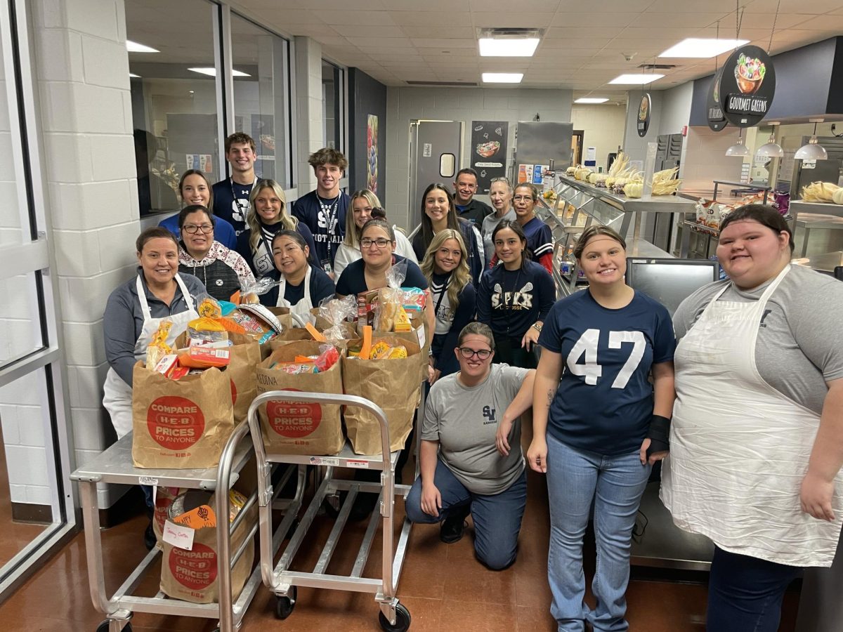 FACS members donate their food donations to the school cafeteria workers. Photo courtesy of FACS program.