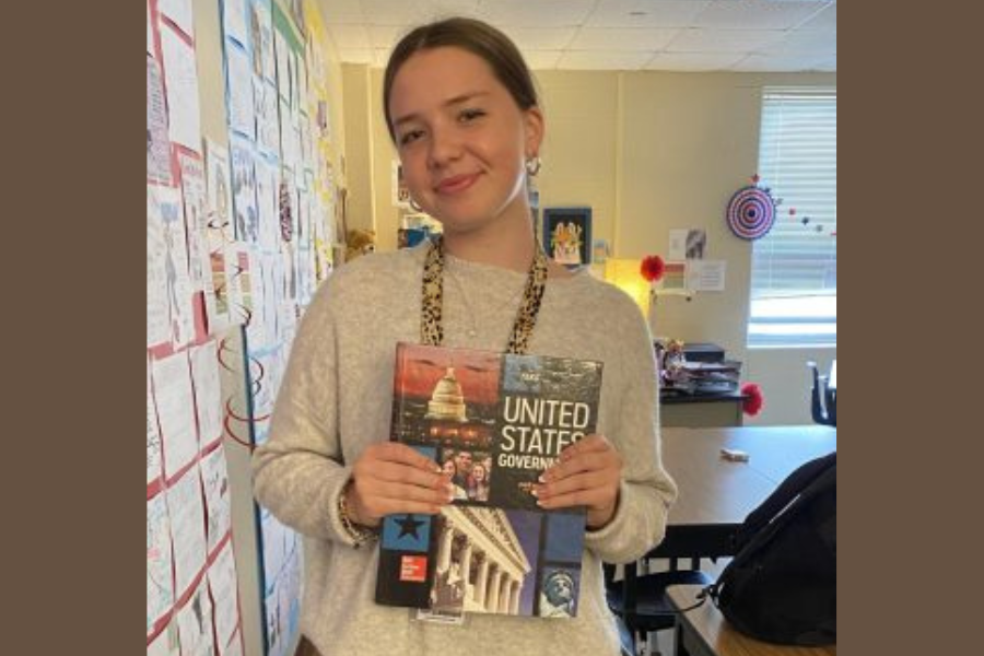 Junior Wiebke Isermann poses with her U.S. government textbook. Isermann is a foreign exchange student from Germany.
