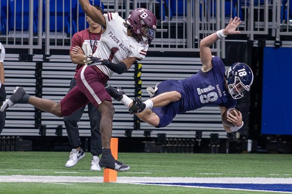 After running 78 yards, senior quarterback Cade Spradling dives for the touchdown against Flour Bluff in the region finals Saturday at the Alamodome. The final score as 49-14.