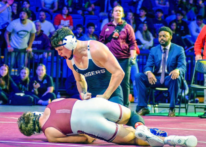 Bryce Palmer standing over Whitehouse's Carter McLaughlin after state final win. (SV Ranger Wrestling)